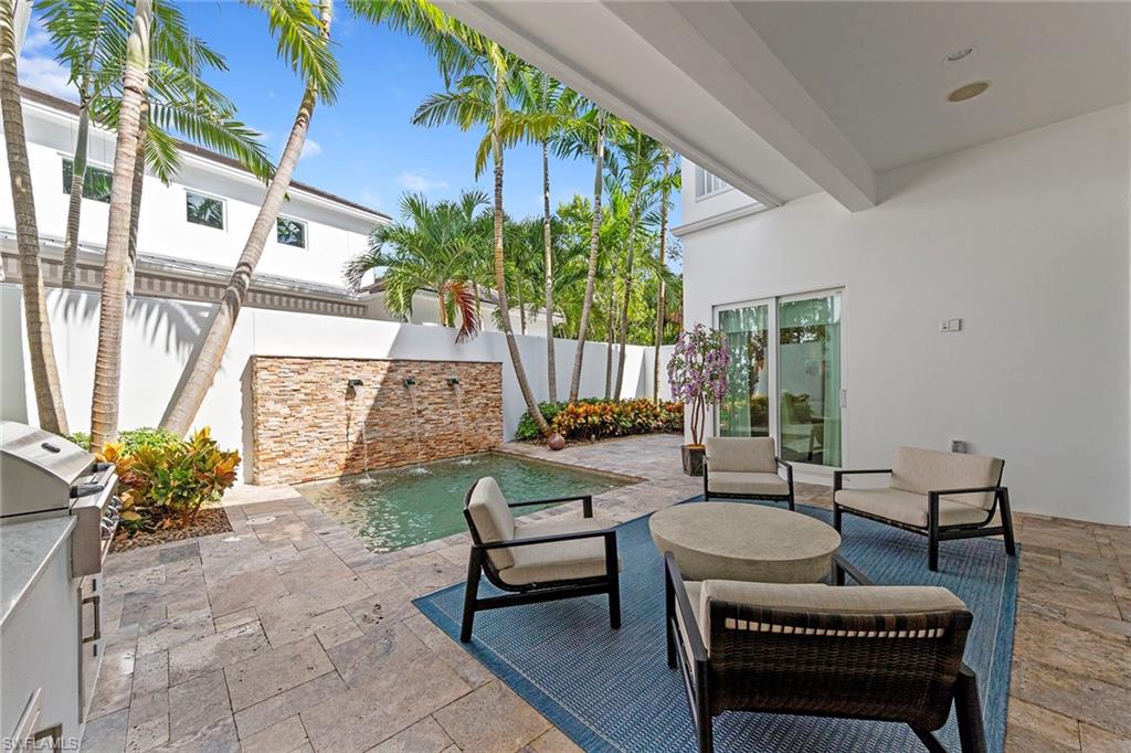 9149 Mercato Way Naples, FL 34108 - Photo 34 of 39 a outdoor living space with patio furniture