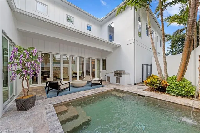 a lobby with furniture and floor to ceiling window