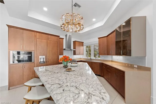 a kitchen with a table chairs and microwave