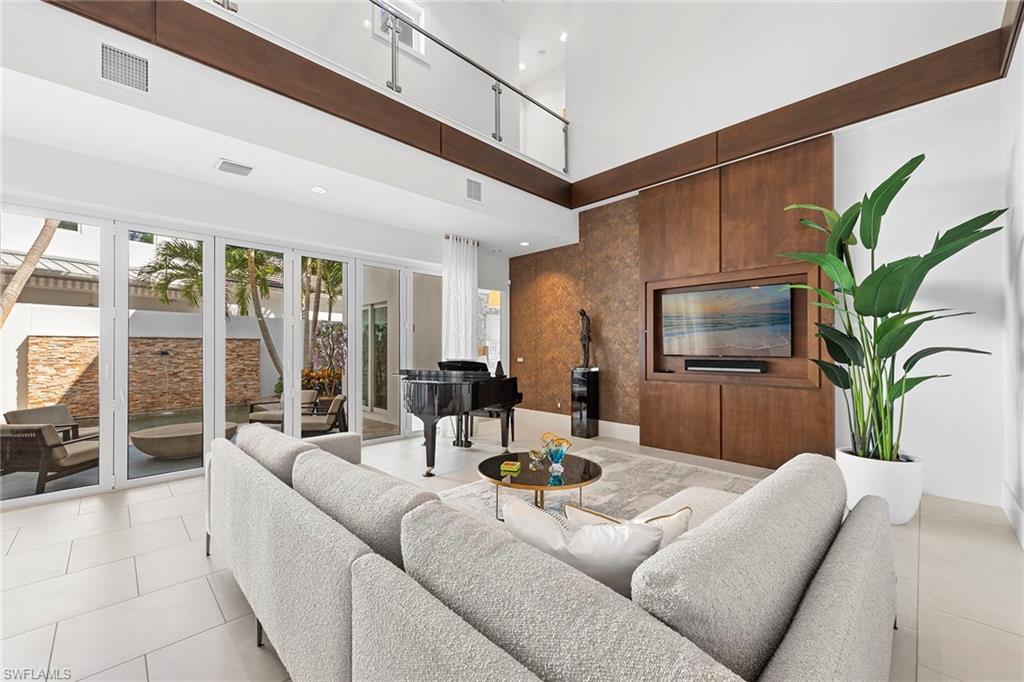 9149 Mercato Way Naples, FL 34108 - Photo 10 of 39 a living room with furniture
