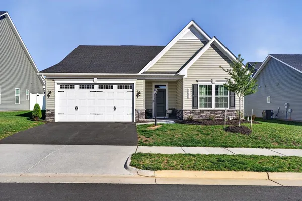 front view of a house with a yard