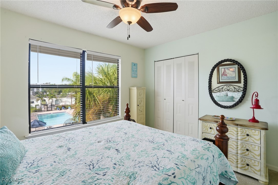13581 Eagle Ridge Drive, Unit 1434 Fort Myers, FL 33912 - Photo 16 of 45 a bedroom with a bed and a window