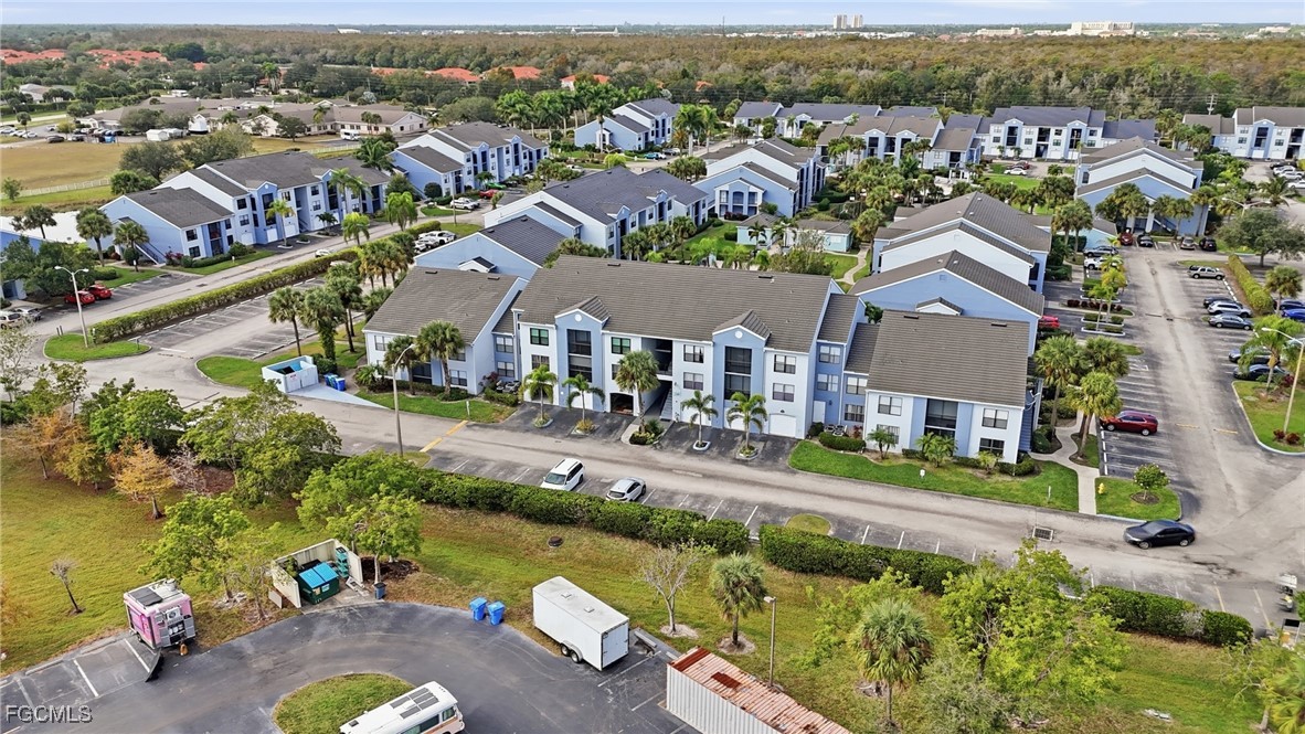 13581 Eagle Ridge Drive, Unit 1434 Fort Myers, FL 33912 - Photo 2 of 45 an aerial view of residential houses with outdoor space