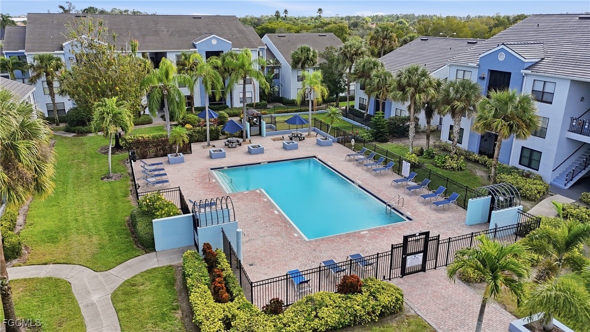 13581 Eagle Ridge Drive, Unit 1434 Fort Myers, FL 33912 - Photo 33 of 45 an aerial view of multiple houses with yard
