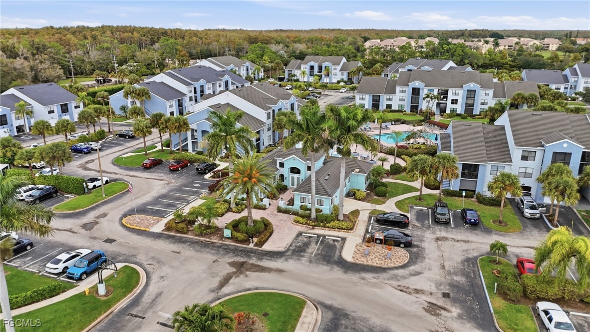 13581 Eagle Ridge Drive, Unit 1434 Fort Myers, FL 33912 - Photo 43 of 45 an aerial view of a house with yard swimming pool and mountain view