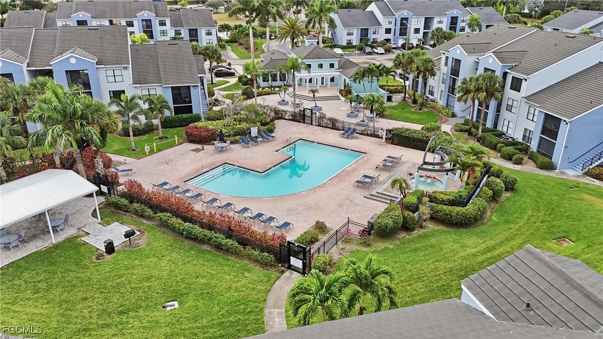 13581 Eagle Ridge Drive, Unit 1434 Fort Myers, FL 33912 - Photo 44 of 45 an aerial view of a house with yard swimming pool and outdoor seating