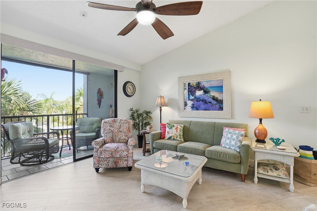 13581 Eagle Ridge Drive, Unit 1434 Fort Myers, FL 33912 - Photo 6 of 45 a living room with furniture and a large window