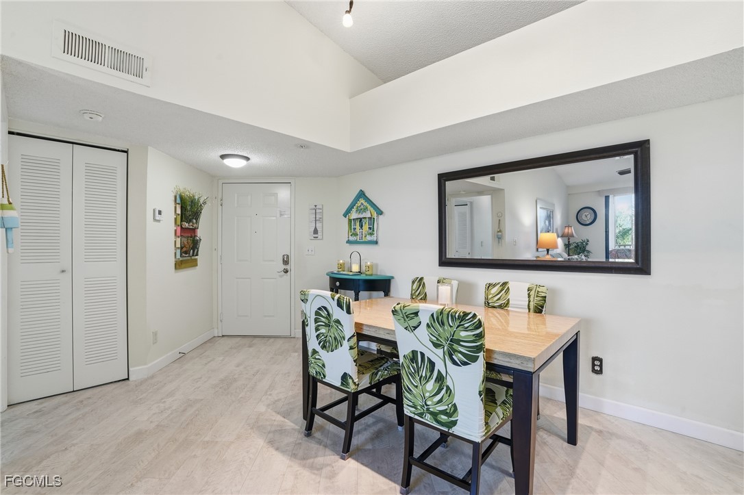 13581 Eagle Ridge Drive, Unit 1434 Fort Myers, FL 33912 - Photo 10 of 45 a view of a dining room with furniture