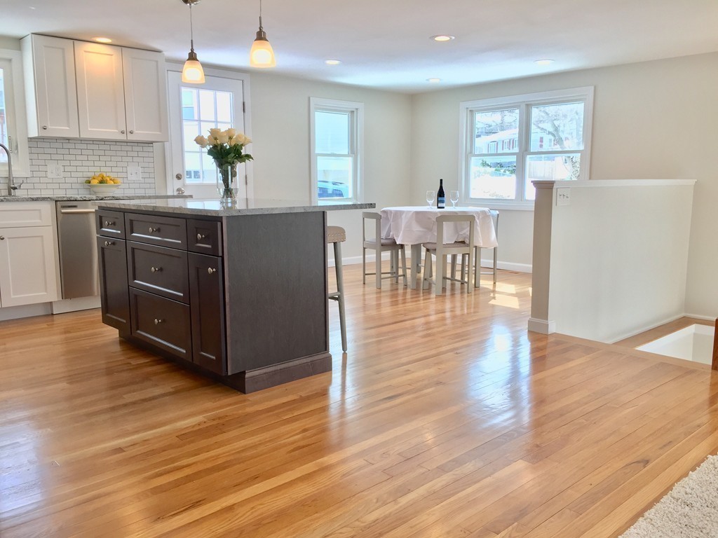 16 Alwin Street Boston, MA 02136 - Photo 4 of 19 a kitchen with stainless steel appliances a dining table chairs and wooden floor
