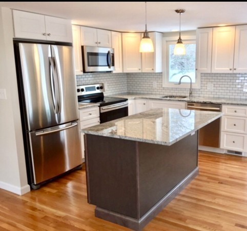 16 Alwin Street Boston, MA 02136 - Photo 5 of 19 a kitchen with stainless steel appliances granite countertop a refrigerator a sink a stove a microwave and island