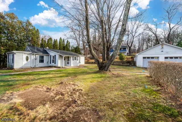 a house with swimming pool in front of it