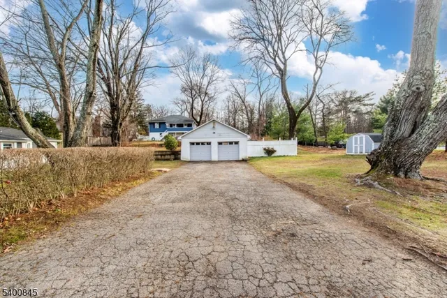 a view of a house with trees in the background