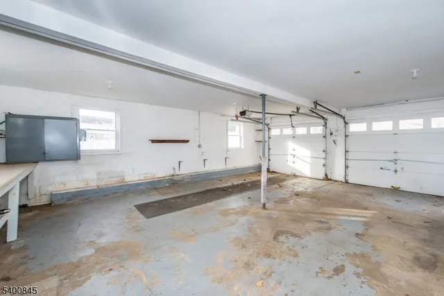 a view of a livingroom with wooden floor and cabinet