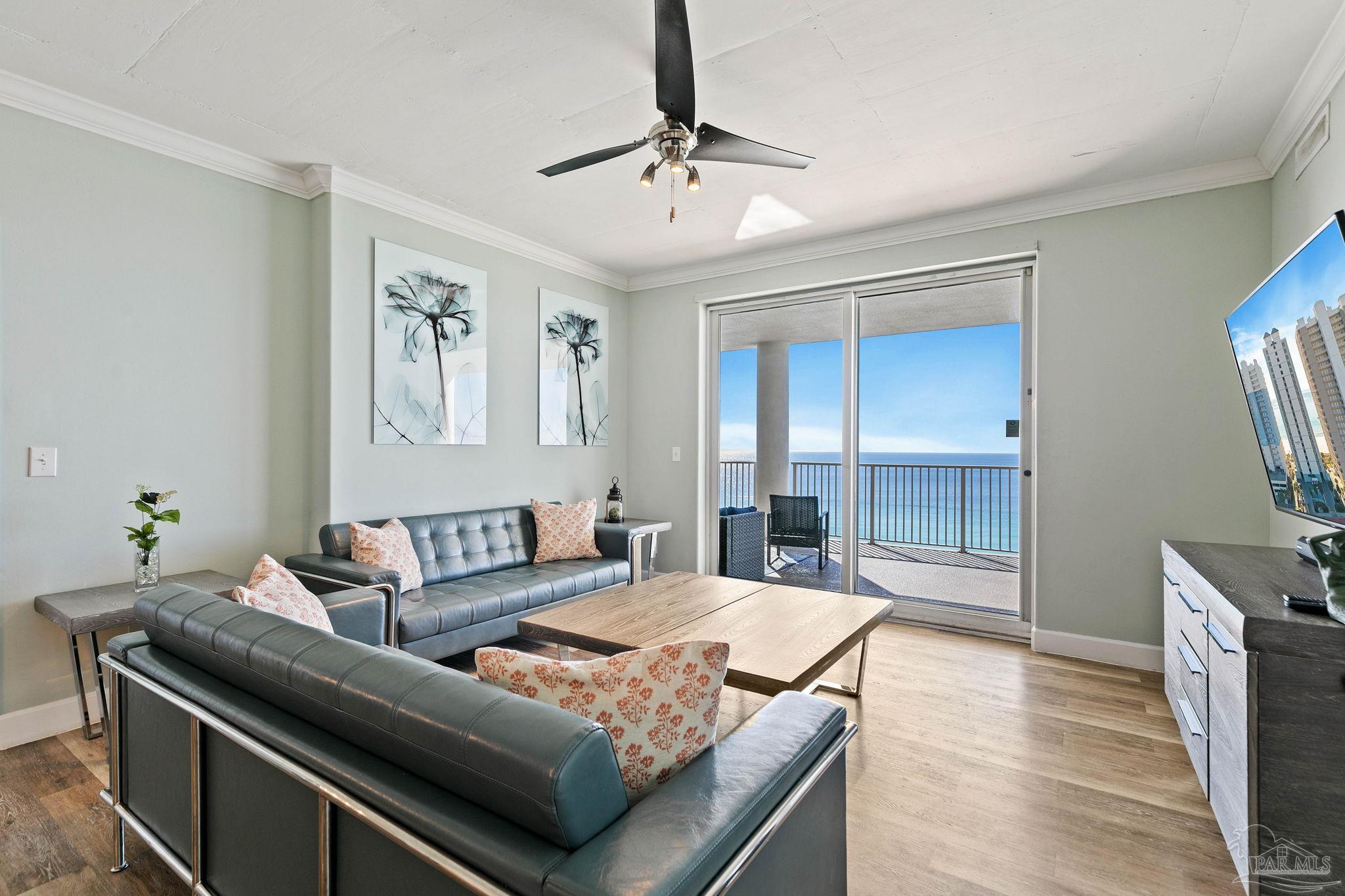10611 Front Beach Road, Unit 1303 Panama City Beach, FL 32408 - Photo 13 of 71 a living room with furniture and a chandelier