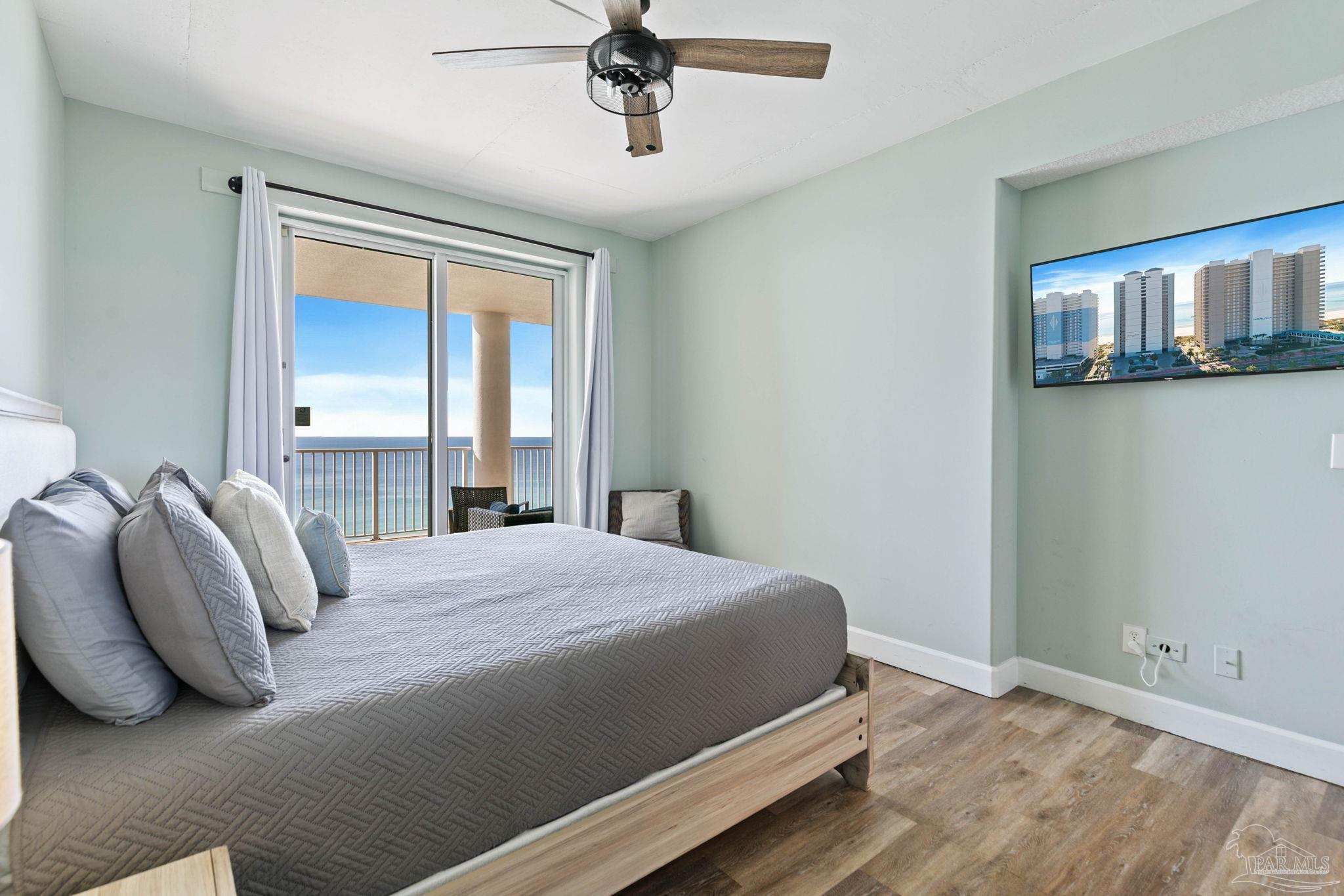 10611 Front Beach Road, Unit 1303 Panama City Beach, FL 32408 - Photo 29 of 71 a bedroom with a bed and window