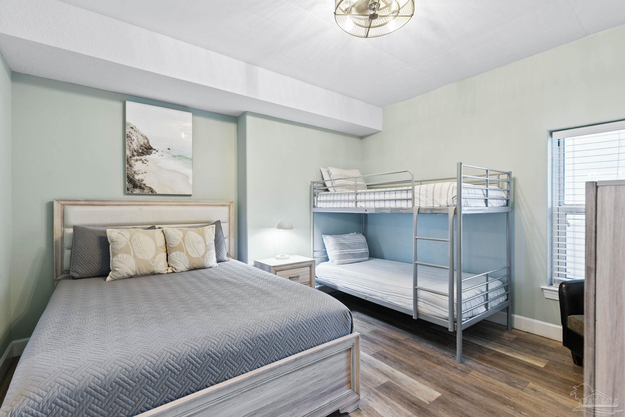 10611 Front Beach Road, Unit 1303 Panama City Beach, FL 32408 - Photo 43 of 71 a bedroom with a bed and a window