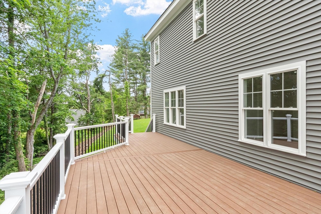 37 Dogwood Road Littleton, MA 01460 - Photo 21 of 36 a view of a balcony with two chairs and wooden floor