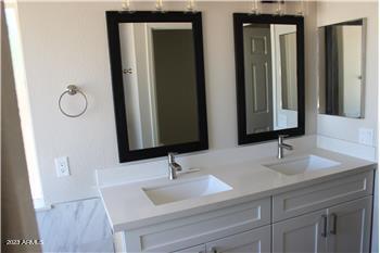 13402 East Boston Street Chandler, AZ 85225 - Photo 8 of 19 a bathroom with a sink and a mirror