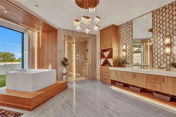 a spacious bathroom with a double vanity sink and a mirror