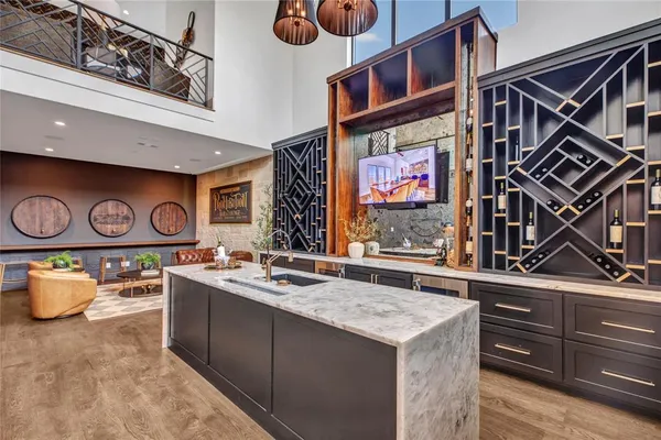 a living room with lots of furniture and a book shelf
