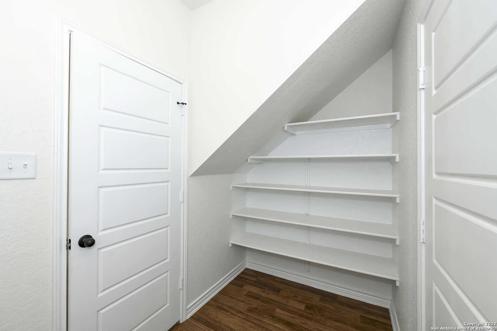 6511 Runaway Row Converse, TX 78109 - Photo 18 of 42 a view of walk in closet with empty racks
