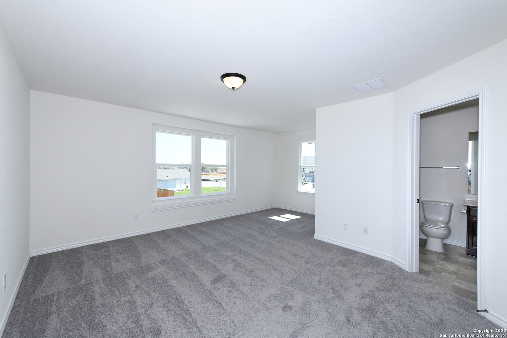 6511 Runaway Row Converse, TX 78109 - Photo 29 of 42 an empty room with windows and a bathroom