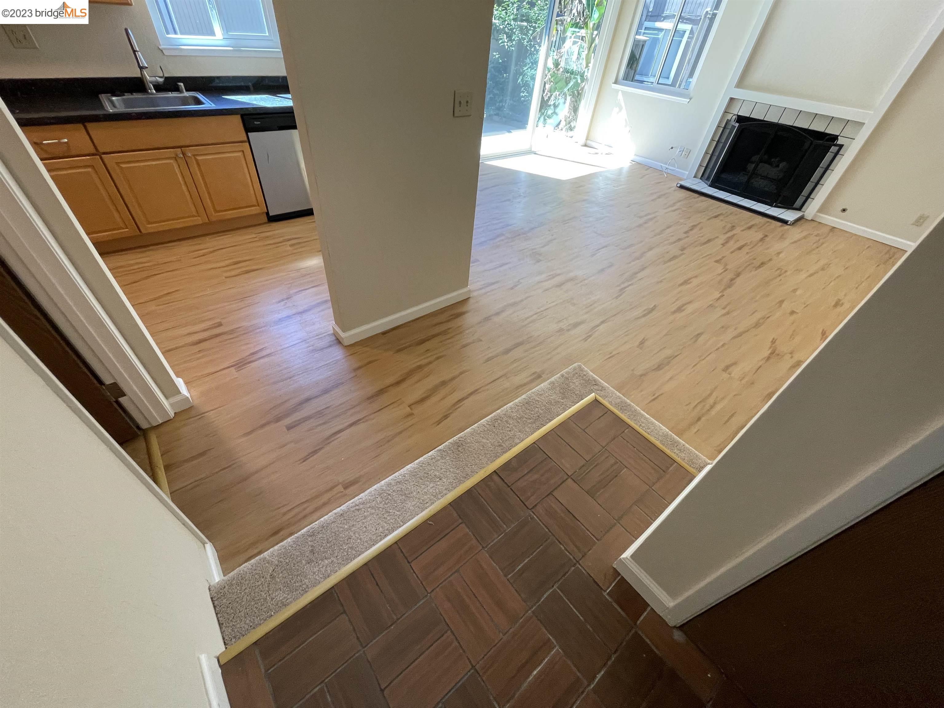 3901 Clayton Road, Unit 57 Concord, CA 94521 - Photo 2 of 40 a kitchen with wooden floor and a stove top oven