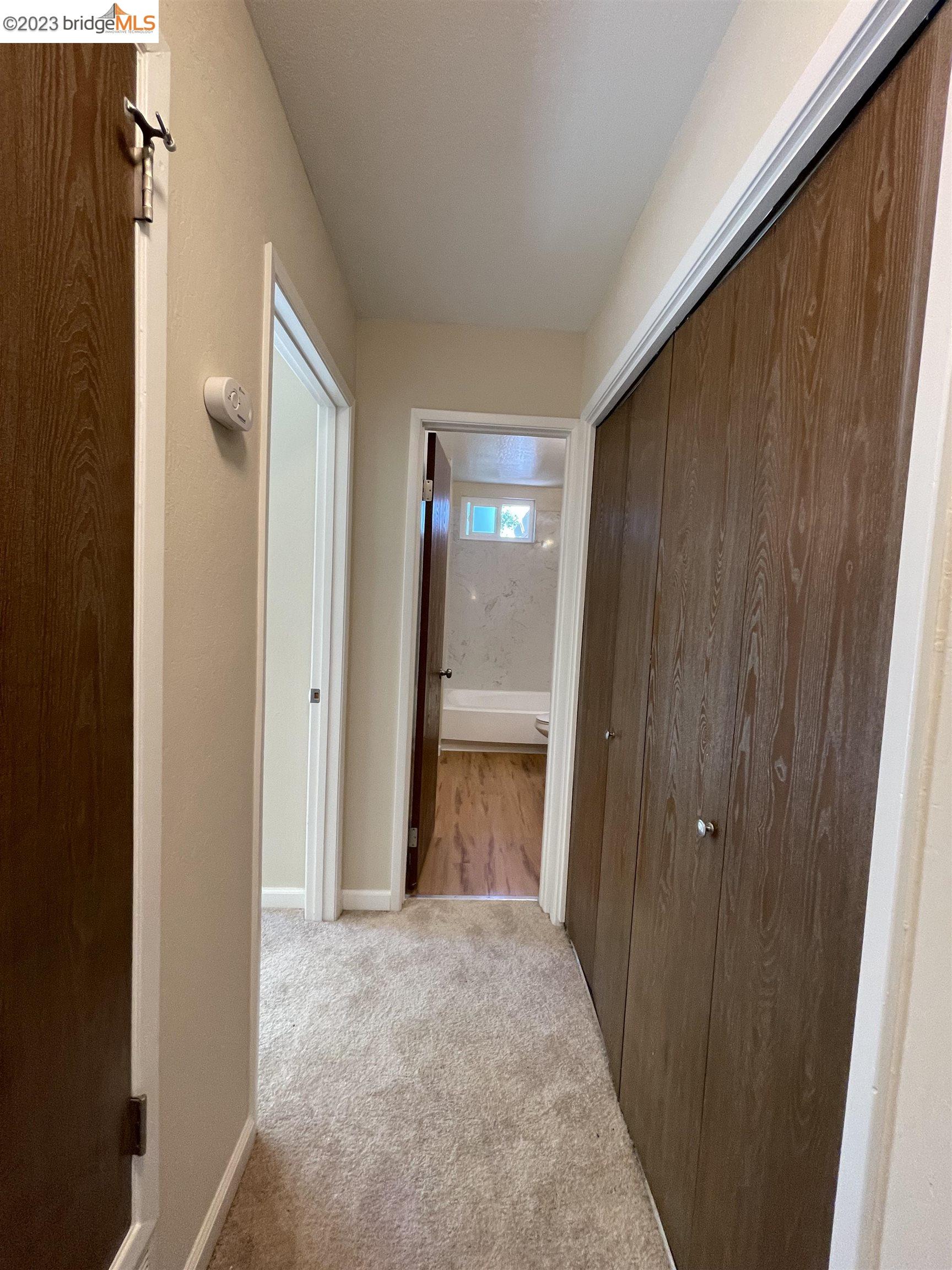 3901 Clayton Road, Unit 57 Concord, CA 94521 - Photo 25 of 40 a view of an empty room with wooden door