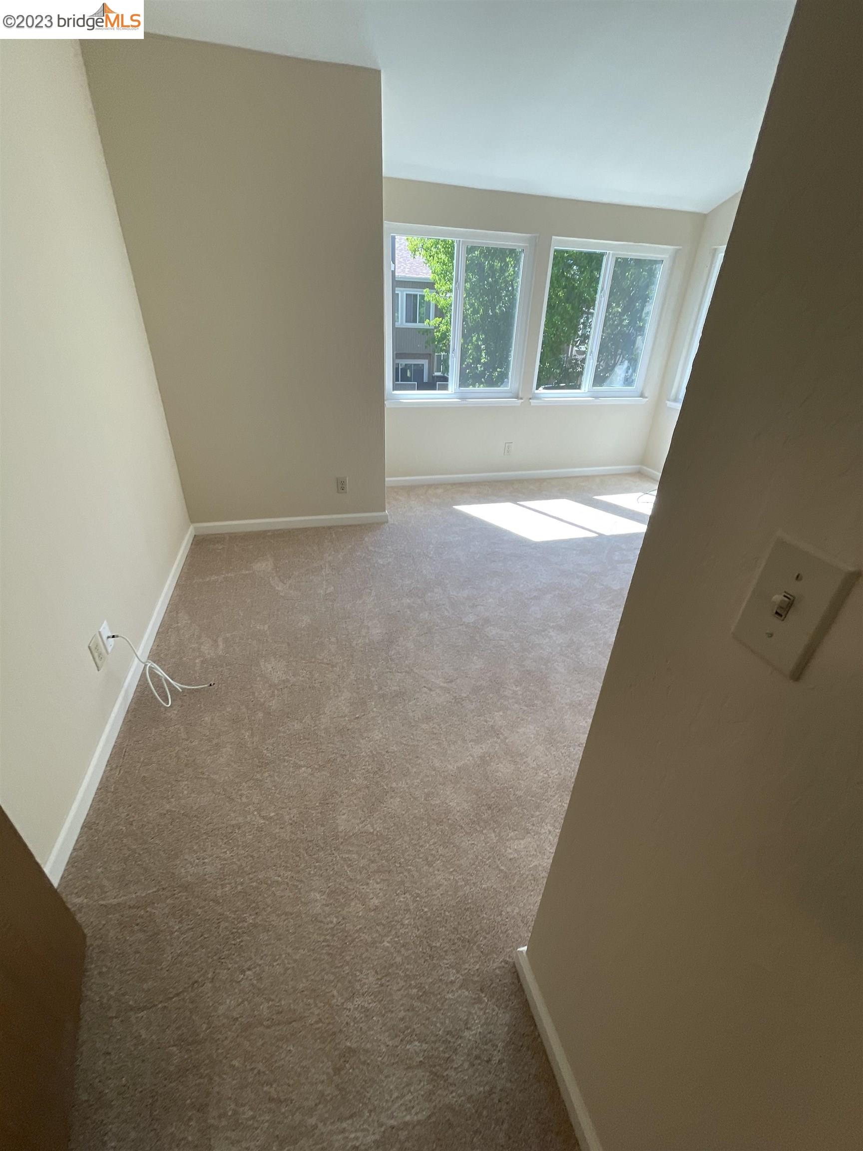 3901 Clayton Road, Unit 57 Concord, CA 94521 - Photo 30 of 40 a view of an empty room with windows