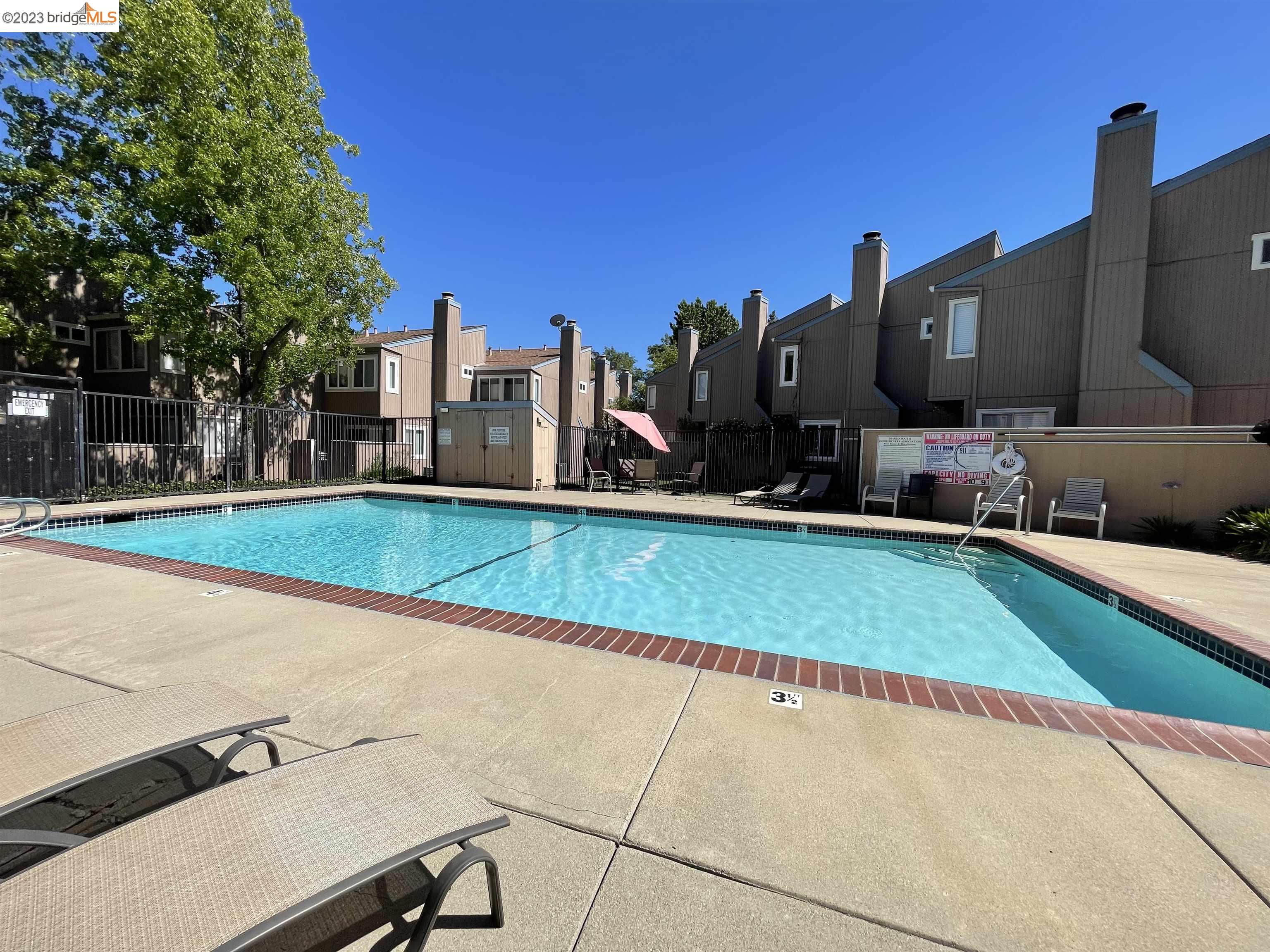 3901 Clayton Road, Unit 57 Concord, CA 94521 - Photo 35 of 40 a view of a house with a swimming pool