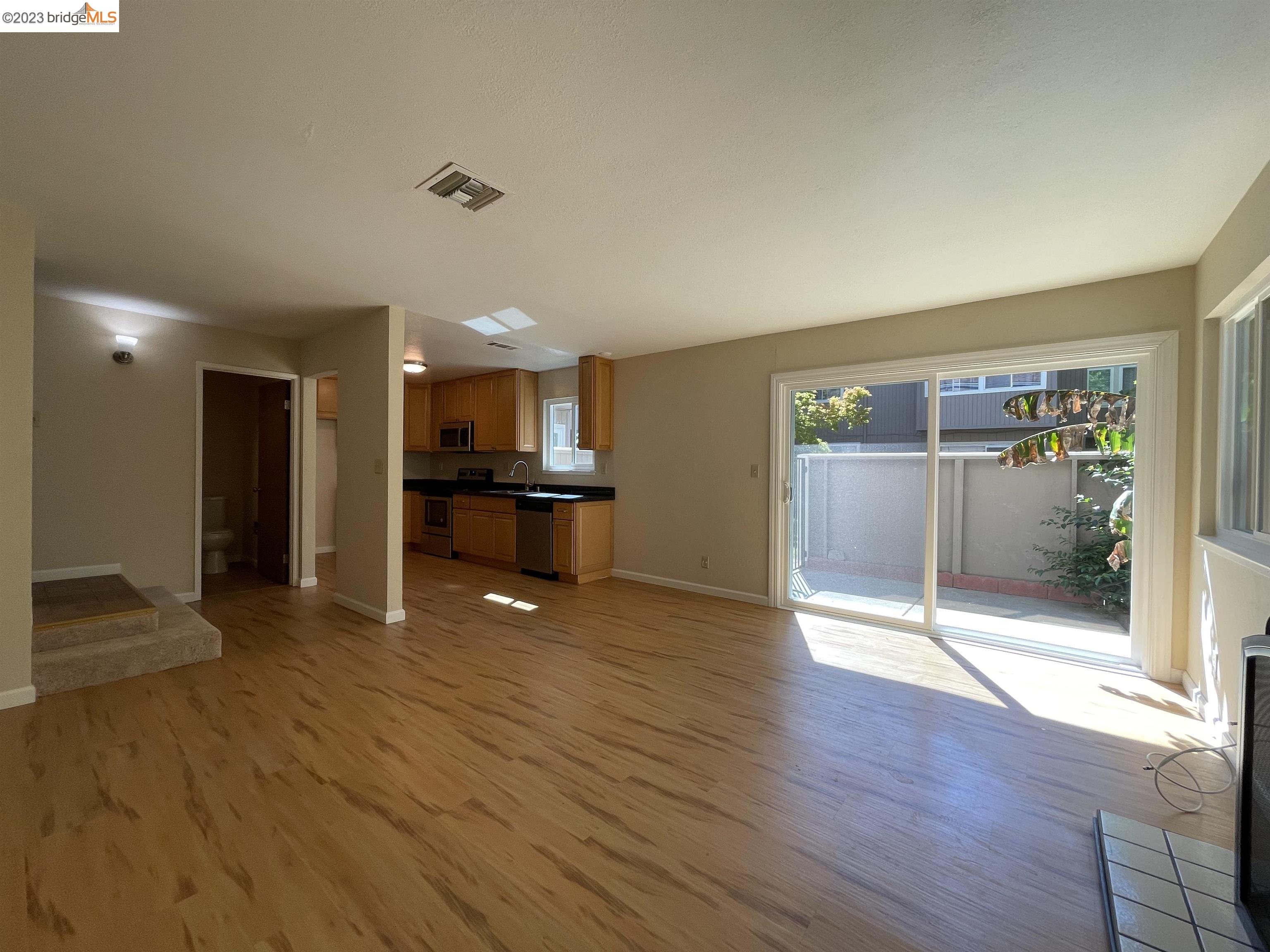 3901 Clayton Road, Unit 57 Concord, CA 94521 - Photo 4 of 40 a view of a big room with wooden floor and windows