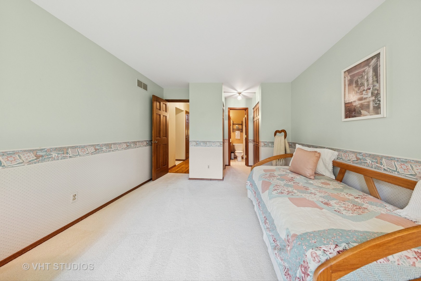 231 Sedgewick Circle St. Charles, IL 60174 - Photo 14 of 24 a bedroom with a large bed and a chandelier