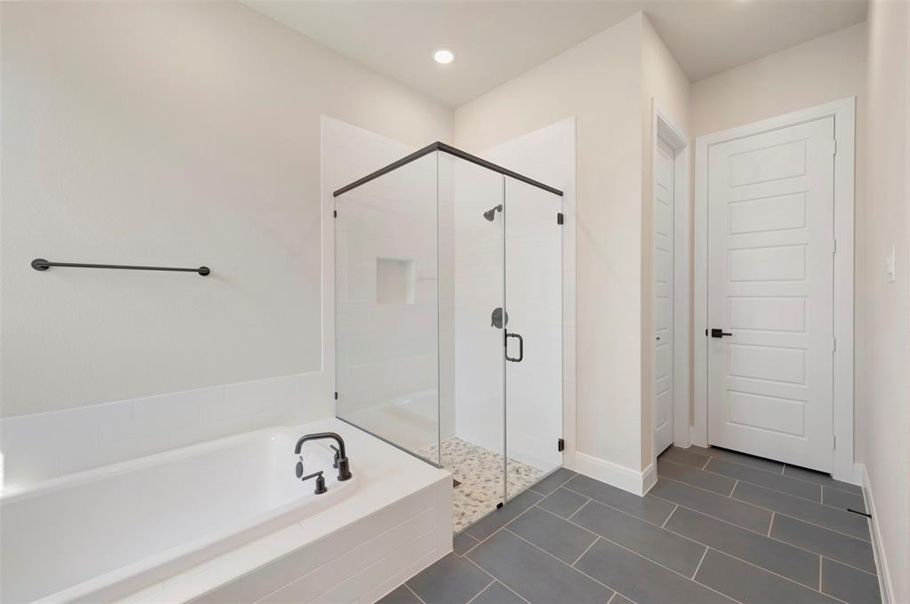 3575 Redbud Flower Trail Venus, TX 76084 - Photo 34 of 36 Full bathroom featuring a stall shower, a bath, dark tile patterned flooring, and recessed lighting