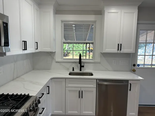 a kitchen with a sink and a window