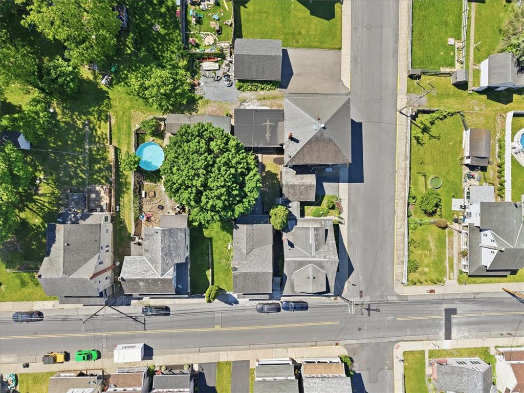 110 Messinger Street Bangor, PA 18013 - Photo 32 of 39 An aerial perspective reveals the residential streets, houses, and backyards, highlighting a compact pool.