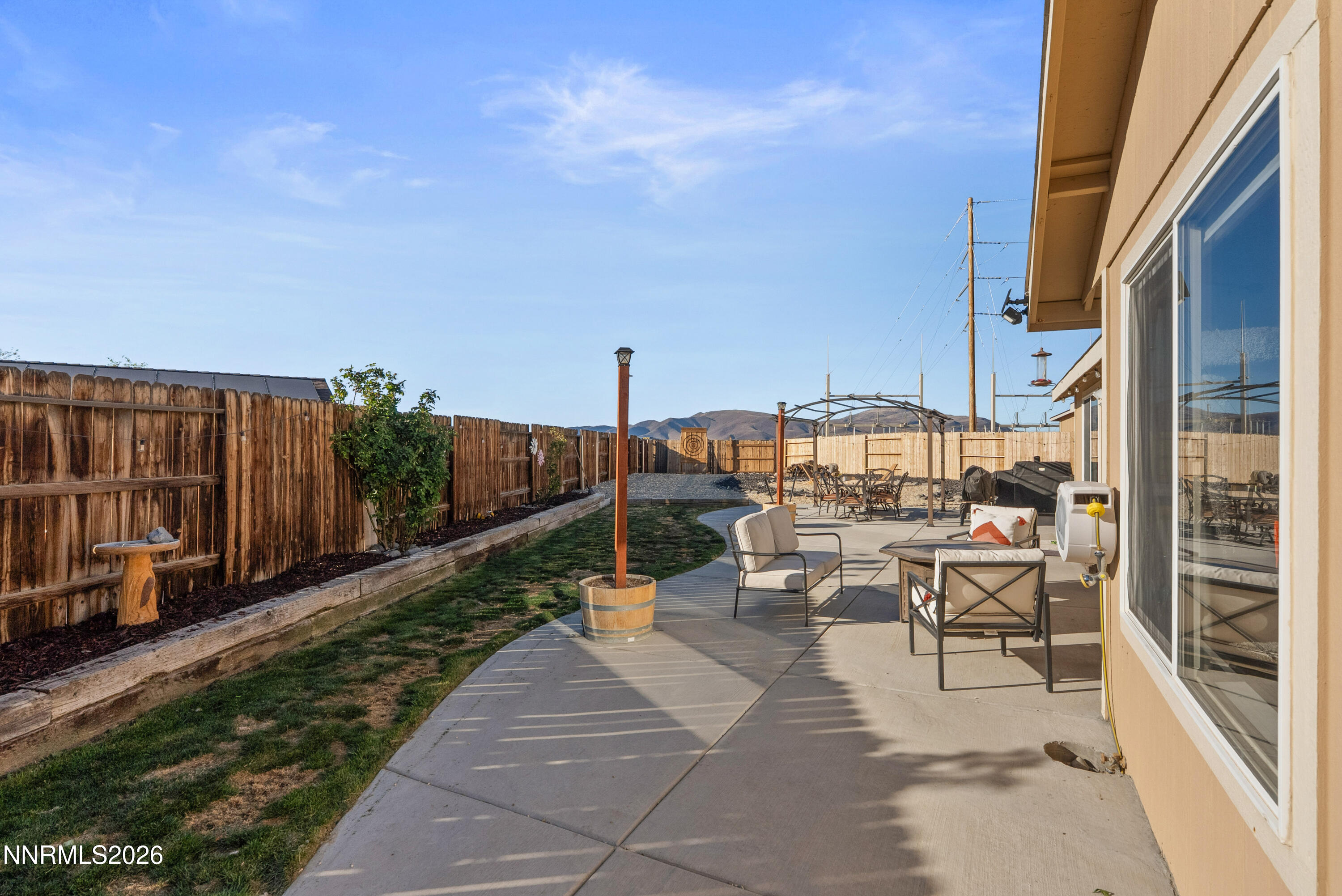 552 Spur Court Fernley, NV 89408 - Photo 37 of 46 a view of a patio with chairs and potted plants