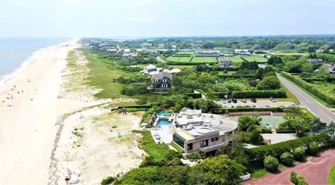 an aerial view of a house with a lake view