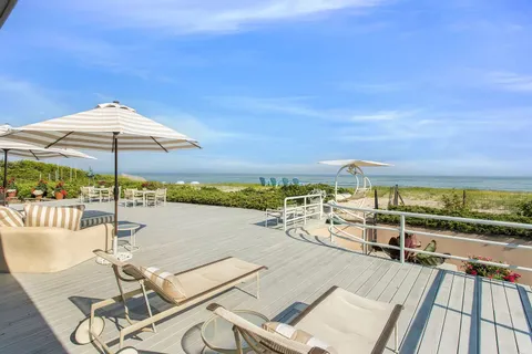 a view of a swimming pool with seating area