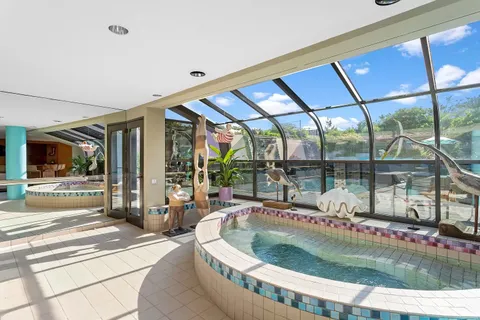 a view of a swimming pool with a patio