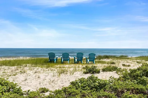 a view of an ocean with a nearby beach