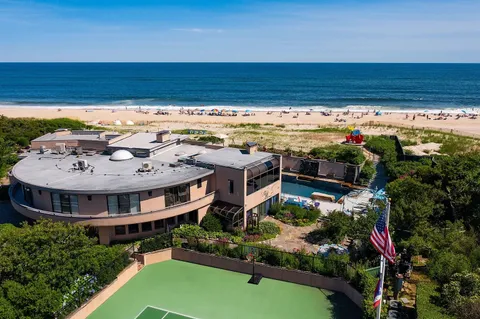 a view of a swimming pool with lounge chairs