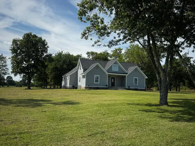 a front of a house with a garden