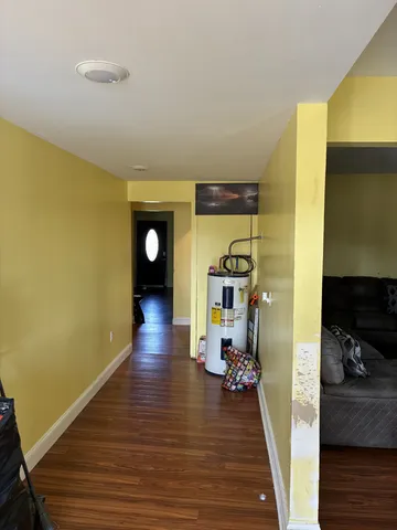 a view of a living room with wooden floor