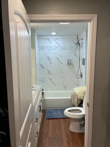 a bathroom with a toilet a sink and a bathtub