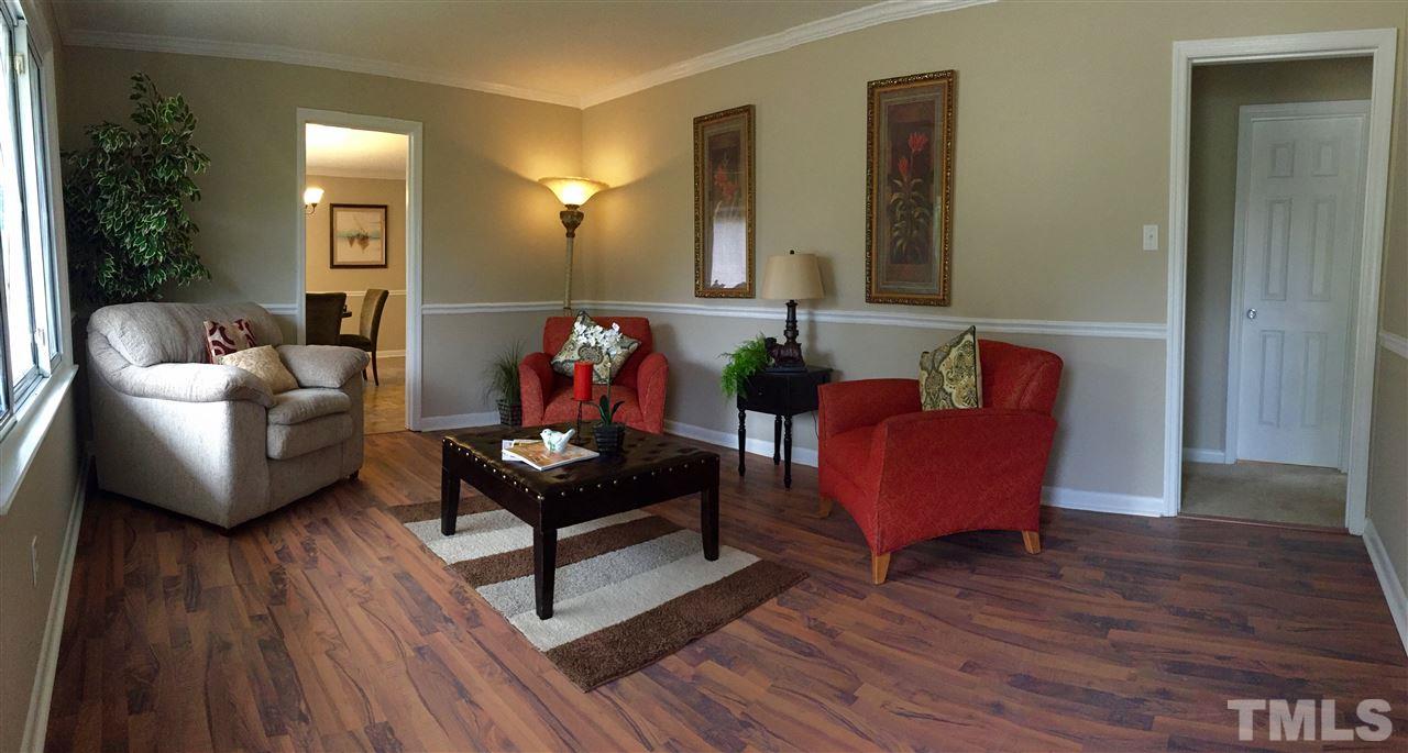 706 Chandler Road Durham, NC 27703 - Photo 1 of 24 a living room with furniture and wooden floor