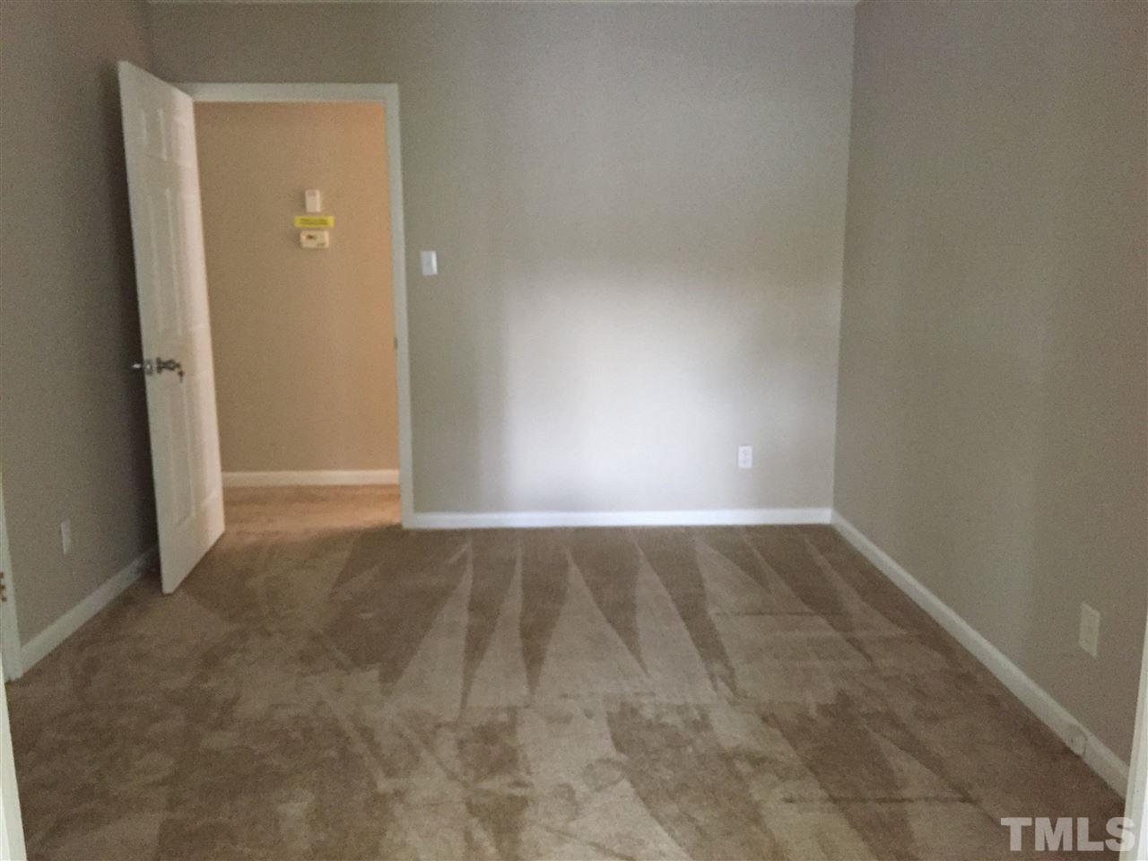 706 Chandler Road Durham, NC 27703 - Photo 15 of 24 a view of an empty room and window
