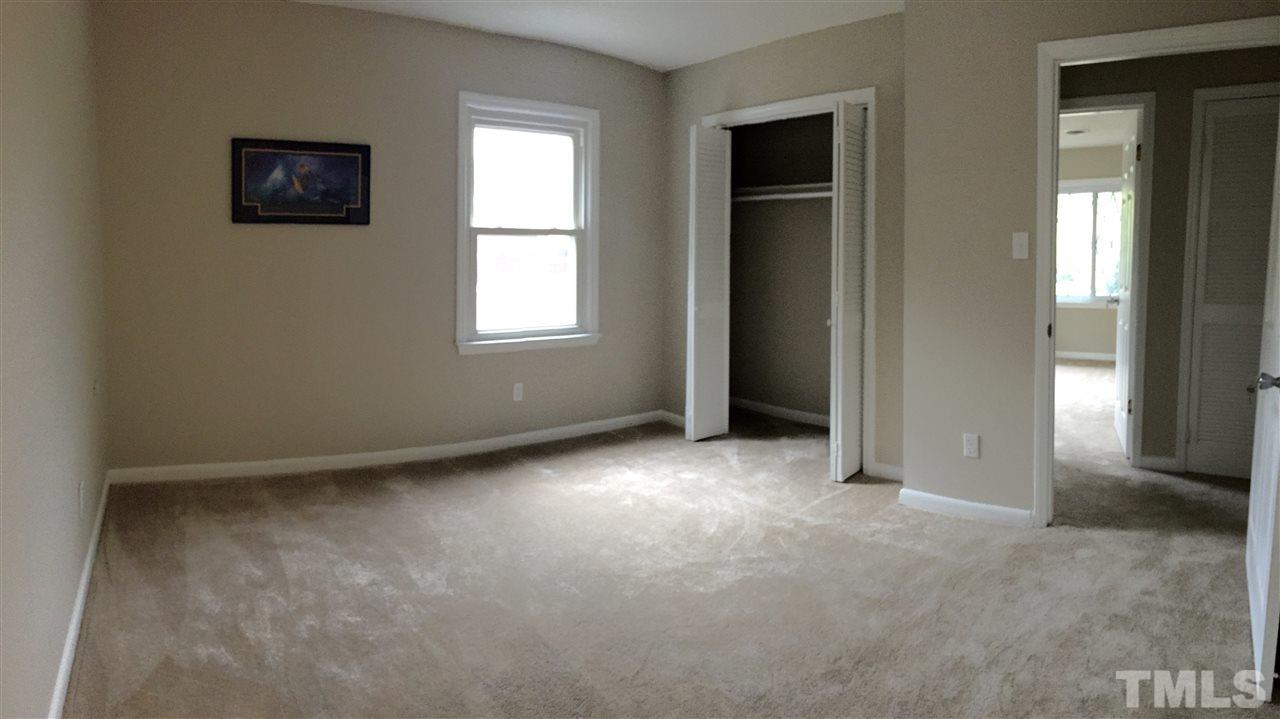 706 Chandler Road Durham, NC 27703 - Photo 17 of 24 an empty room with windows and closet