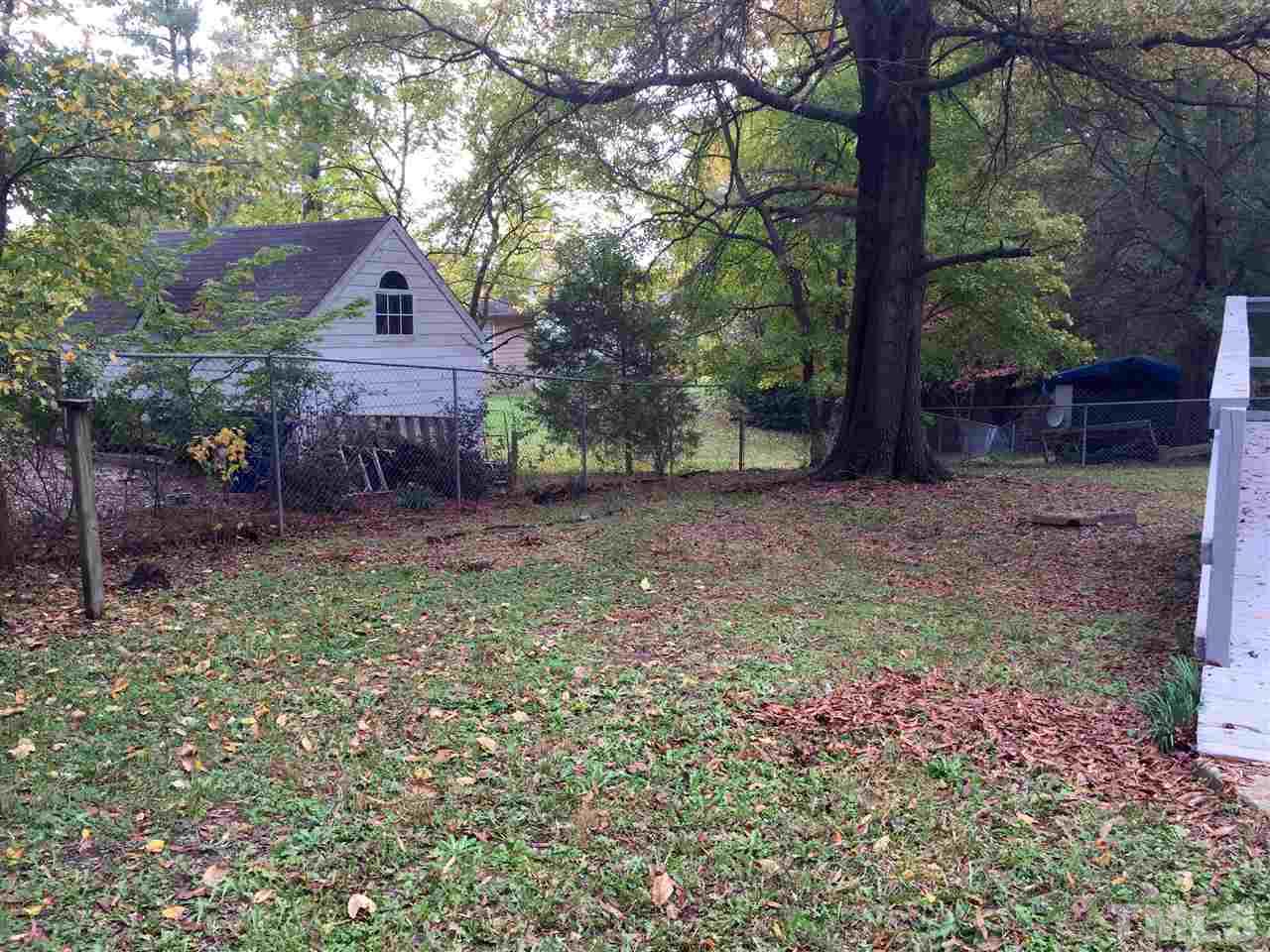 706 Chandler Road Durham, NC 27703 - Photo 22 of 24 a view of a house with yard and a tree