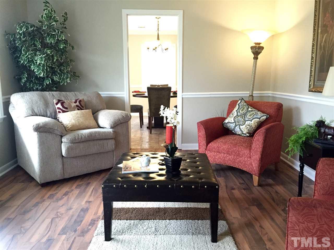706 Chandler Road Durham, NC 27703 - Photo 4 of 24 a living room with furniture and wooden floor