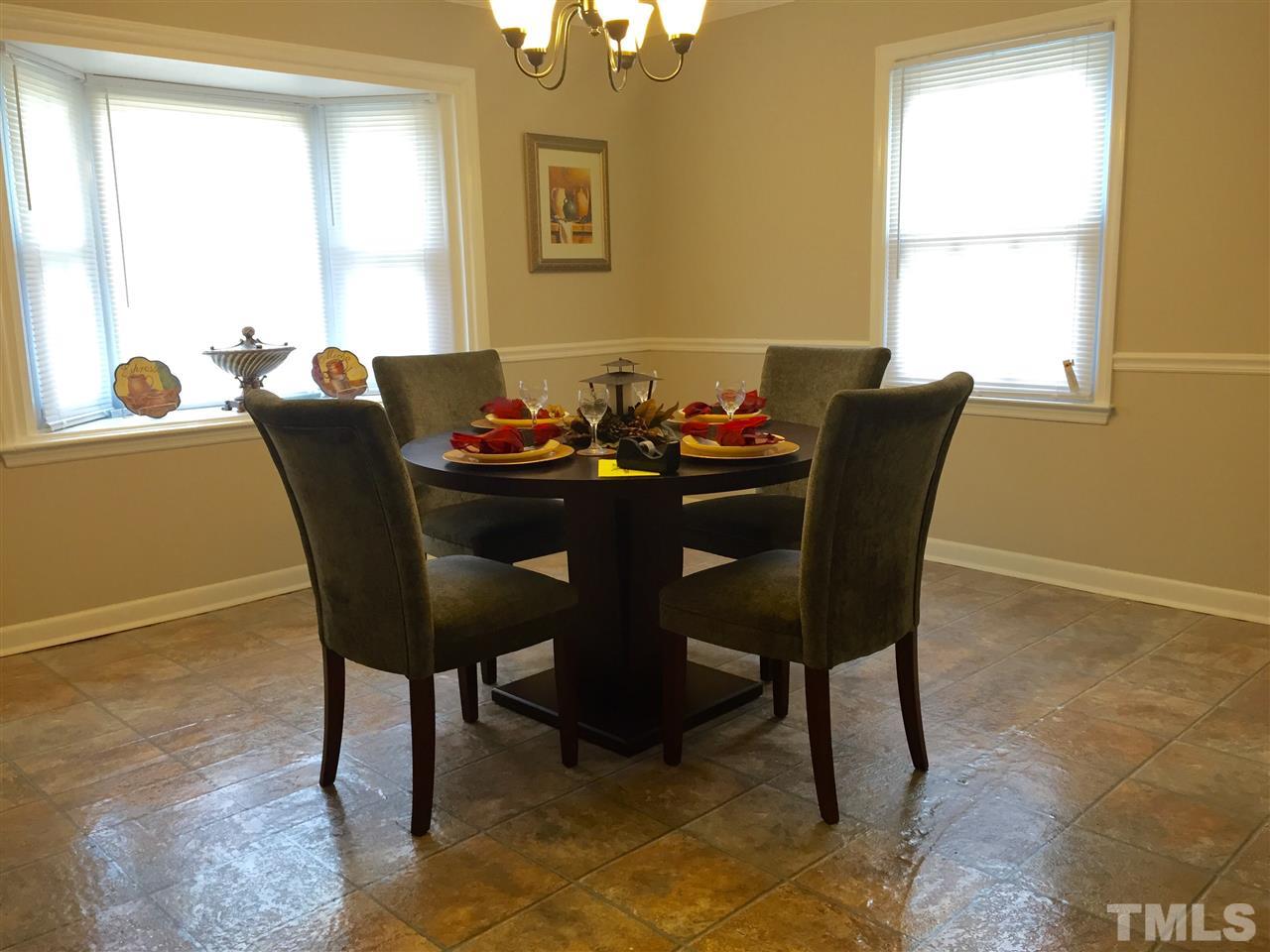 706 Chandler Road Durham, NC 27703 - Photo 7 of 24 a dining room with furniture and window